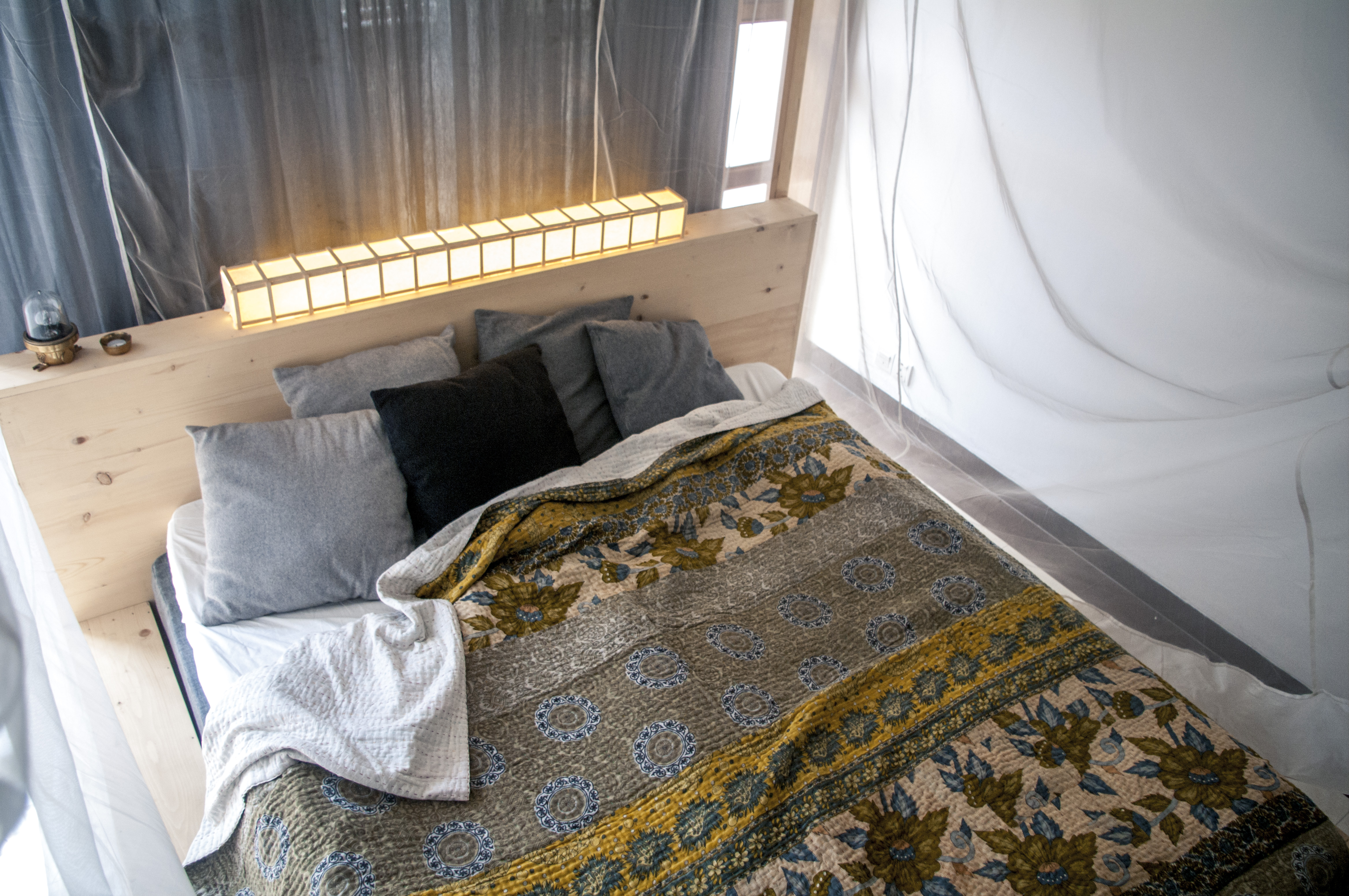 A King Sized Kantha sewn bedspread makes the whole bedroom feel warm and luxurious