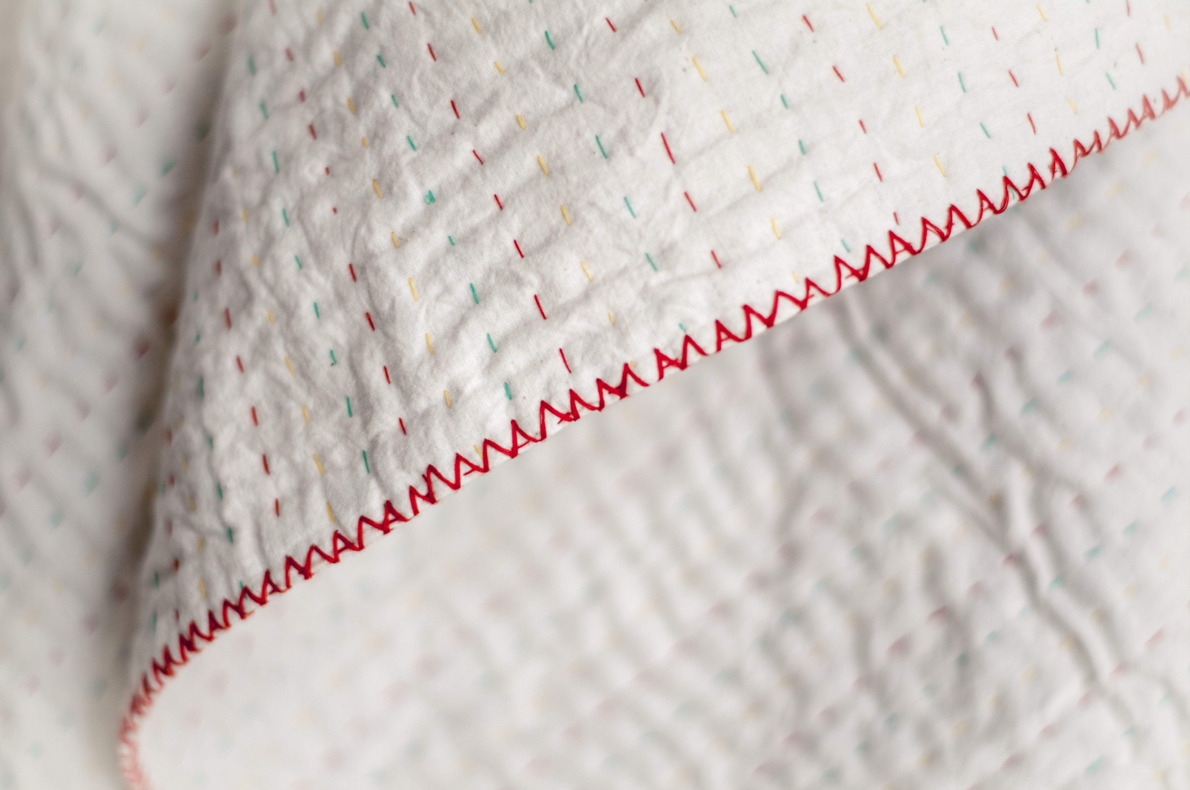 The natural throw allows the beautiful Kantha stitch to shine